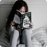  girl reading a book